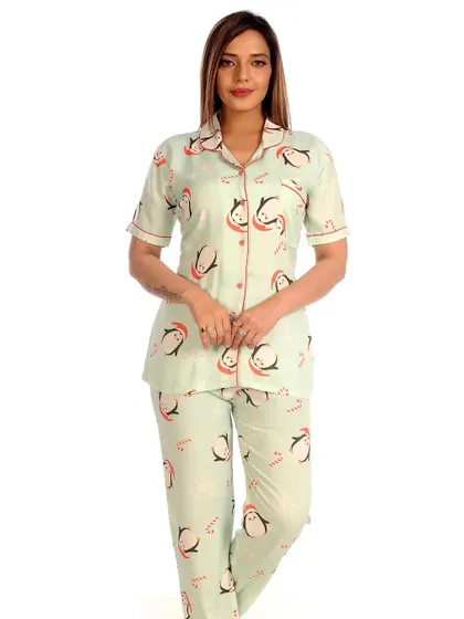 Get into the festive spirit or just enjoy a cute animal print with my penguin pajama set. The cool, mint green fabric is adorned with adorable penguins, making it a charming and comfortable option for any season.