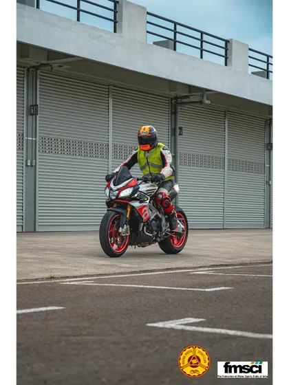 An Aprilia Tuono V4 rolling through the paddock. It's awesome to see naked bikes mixing it up with the superbikes.