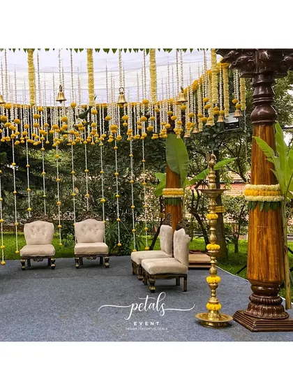 The seating arrangement for this South Indian wedding is designed to be both comfortable and beautiful. The chairs are positioned to offer guests a clear view of the ornate mandap and its traditional decorations.