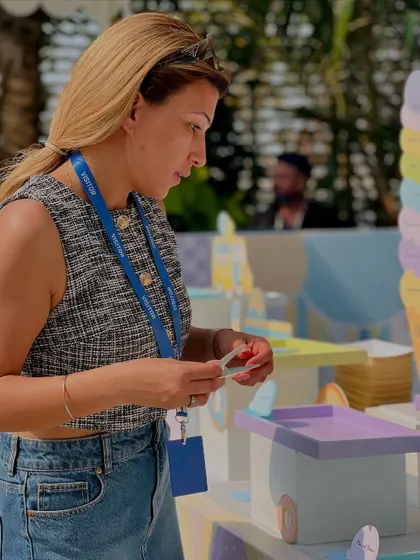 Our event stylist puts the finishing touches on the dessert display, ensuring every detail is perfect.
