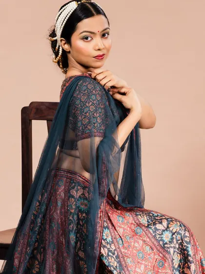 A seated portrait of a model in a beautiful printed lehenga with a sheer dupatta. This showcases my work with Indian ethnic wear for brand lookbooks and model portfolios.