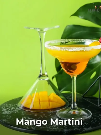A creative presentation of a Mango Martini. We believe glassware and garnish are key to the overall cocktail experience.