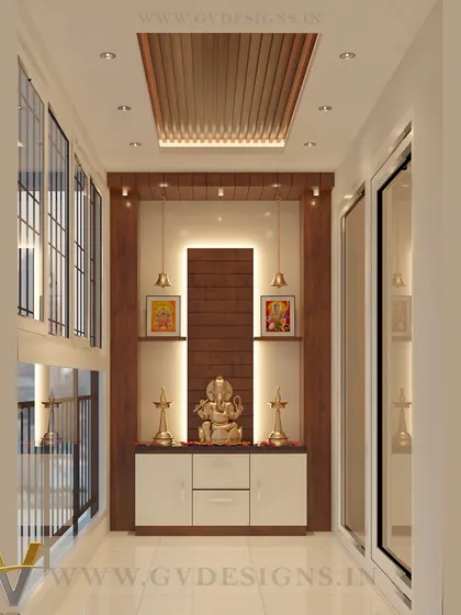 For homes with limited space, we can transform a balcony into a serene pooja area. This design takes advantage of natural light and incorporates a custom mandir with storage, elegant lighting, and a false ceiling detail.