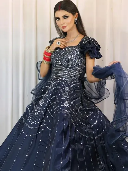 A beautiful navy blue gown with silver sequin work, available for rent. I've paired it with a simple diamond-style necklace and earrings to keep the look elegant and modern.