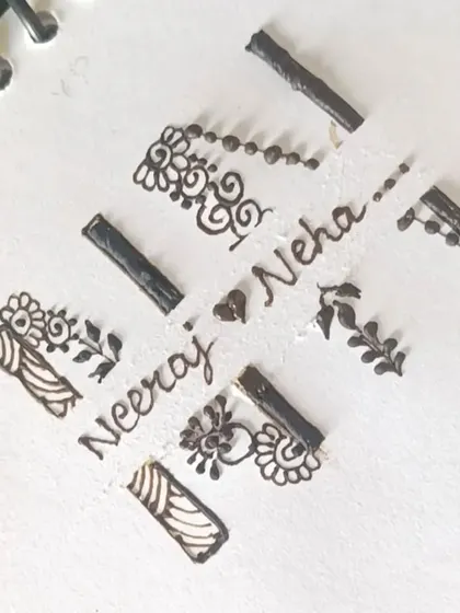 A practice sheet showing an initial design for 'N' and 'N'.