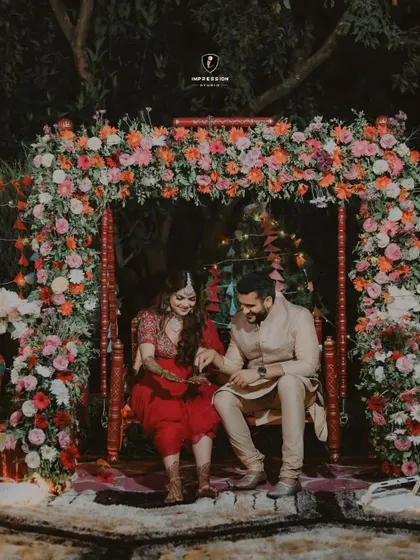 The groom searching for his name in the bride's mehendi. This is a classic, sweet tradition that I love to capture in a natural, candid way.
