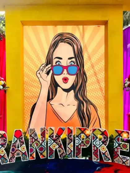 Personalization is key. For this event, I created a custom backdrop with pop art and the couple's name in a unique, patterned font, making the decor feel exclusive and personal.