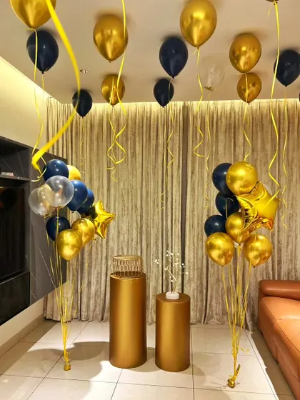 Simple yet elegant, these helium balloon bouquets with matching golden pedestals can transform any room for a celebration.