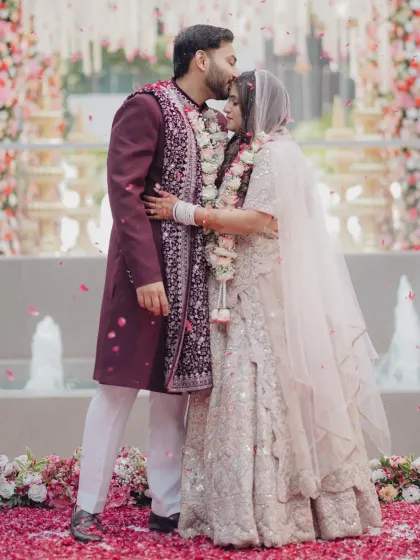 A moment of quiet love amidst a shower of petals for Sanket and Shivangi. Their embrace speaks volumes.