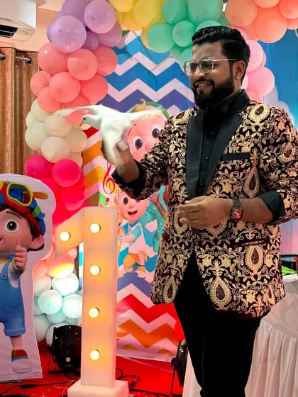 A dove rests on my hand after magically appearing during a first birthday party. Animal magic adds a gentle and wondrous touch to any family celebration.