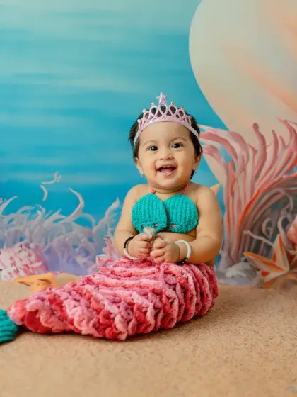 Another joyful, smiling portrait that perfectly captures the happiness of turning one.