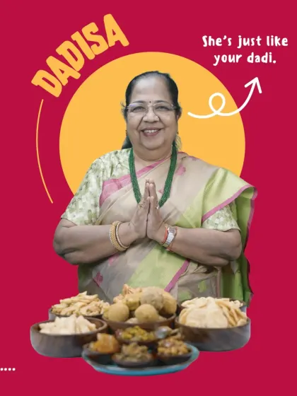 Meet Dadisaa, the heart and soul of our kitchen. She is just like your own dadi, pouring her love and years of experience into every recipe. In front of her is a spread of her signature creations, from crispy mathri to wholesome laddoos, all waiting to bring a taste of home to you.