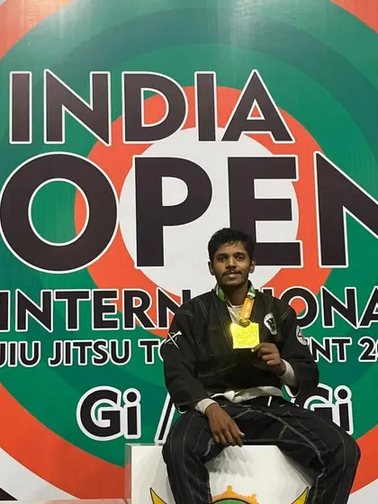 On the top of the podium with my gold medal in the Gi division at the India Open International Jiu-Jitsu tournament.