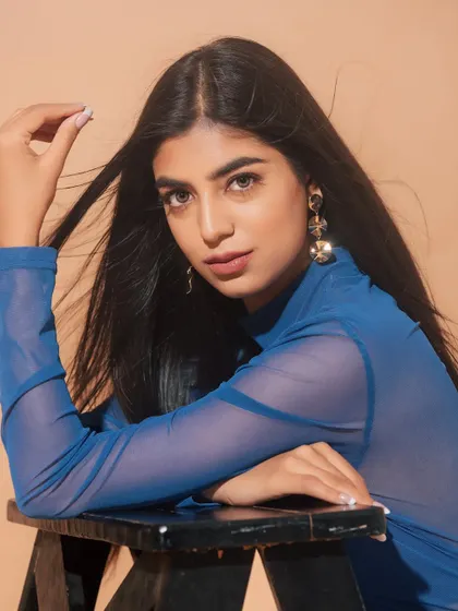 A beautiful close-up. The soft, neutral makeup allows her natural features to shine, and the simple hairstyle keeps the look modern and chic.
