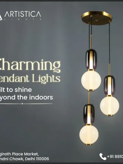 This charming cluster of pendant lights combines frosted white globes with elegant metallic accents. It's a versatile piece that works beautifully in a variety of settings, from a stylish entryway to a cozy reading corner, providing a soft and welcoming glow.