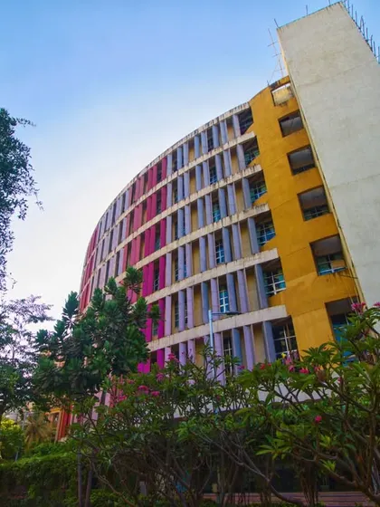 This perspective of the K.J. Somaiya College building shows its harmonious relationship with the surrounding green landscape. Our design philosophy ensures that even large urban structures are thoughtfully sited to preserve and enhance the natural environment, creating a complete and balanced campus experience.