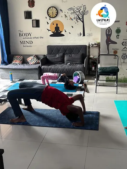 Kids enjoying a yoga session, practicing backbends together. Group classes for children are designed to be playful, social, and beneficial for their growing bodies.