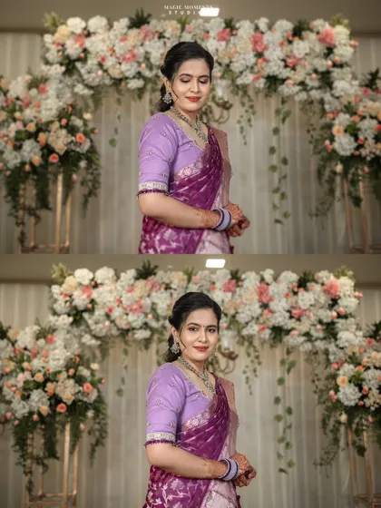 A full-length portrait of the bride-to-be in her elegant purple saree, standing before the beautiful floral arch at her engagement venue.