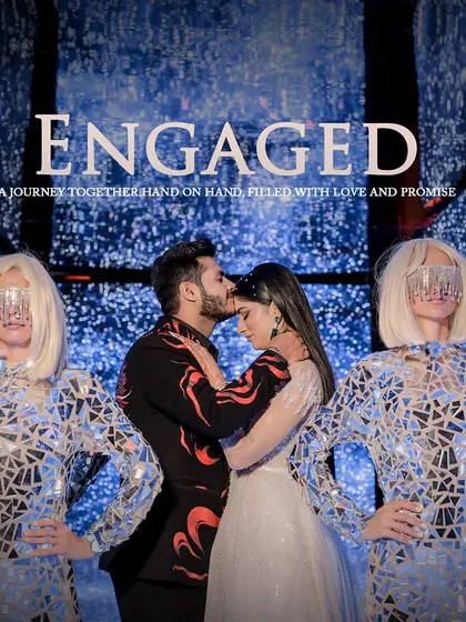 The engagement photo that says it all. We conceptualized this shot with futuristic dancers and a galaxy-themed backdrop to announce their journey together.