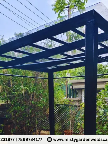 A closer look at the compact sheet pergola, showing the clean lines of the black metal frame and the translucent roofing that allows soft, diffused light to pass through.