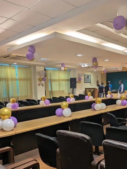 Another angle of the decorated room, showing the arrangement of seating and decor. This demonstrates how I can transform a standard hall into a vibrant party space.