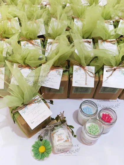 The complete, packaged gift boxes for the 50th birthday celebration, wrapped in elegant green net.