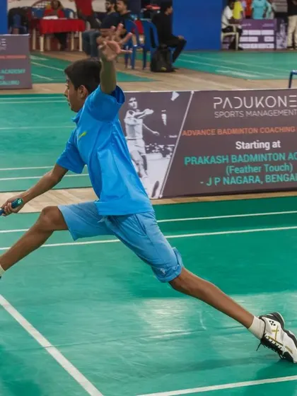 Another young athlete in action, reaching for a shot during a competitive match. Our events are filled with non-stop badminton action.