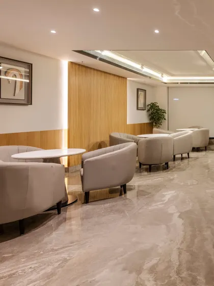 Additional views of the Radisson Resort, Khopoli, showcasing various interior and exterior details, from lobby seating areas and restaurant layouts to guest room configurations and architectural elements.