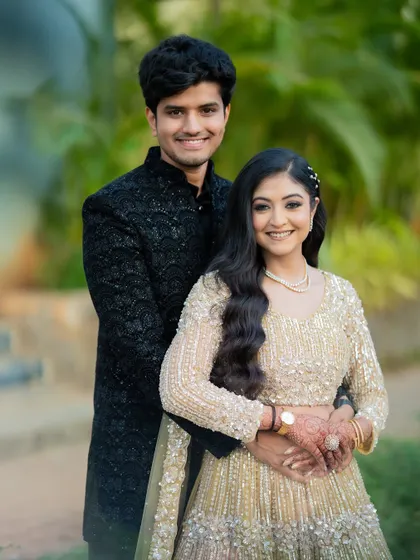 A classic portrait of Apoorv and Shikha, smiling for the camera. This type of shot is essential for any engagement album, capturing the couple looking their best.