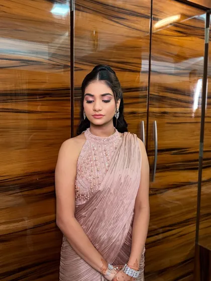 This Roka bride opted for a sophisticated look with a high-neck gown. The makeup features a dramatic pink winged eyeshadow, making a bold statement.