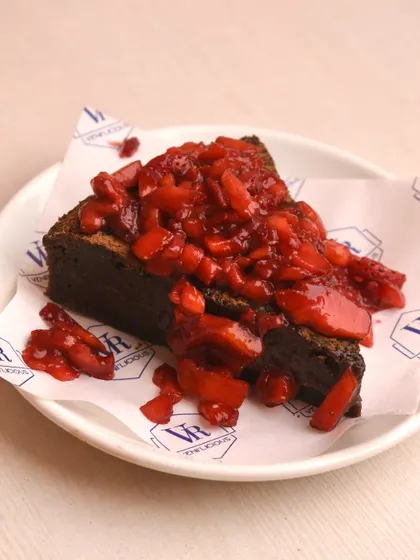 A slice of our rich gooey brownie, generously topped with a fresh strawberry compote. The combination of chocolate and strawberry is simply divine.