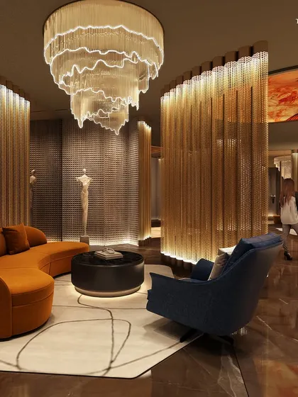 Another view of the Palais Royale lobby, showcasing the interplay of light and texture. The curved, illuminated partitions and sculptural furniture create a sense of exclusivity and refined comfort.