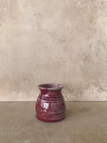 Another small, magenta-glazed pot, showing the beautiful variations that happen in the kiln.