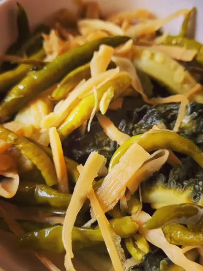 A close-up view of the boiled bitter gourd and bamboo shoot side dish. This is a very common and healthy accompaniment in Naga meals.