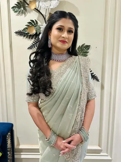 My engagement bride Riya looking beautiful in her saree. The soft waves in her hair and glowing makeup complete this classic look.