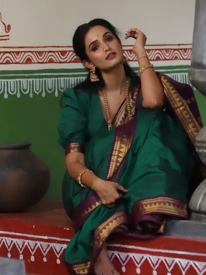 This look is all about creating a timeless portrait. The makeup is minimal, allowing the actress's natural beauty and the traditional setting to shine.