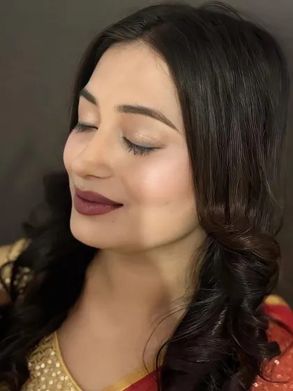 A moment of quiet confidence. This image showcases the smooth, airbrushed-like finish of the skin and the soft, shimmery eyeshadow.