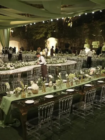 An overhead view of the gala dinner, showing the combination of long and round tables, all meticulously decorated to fit the sage and ivory theme.