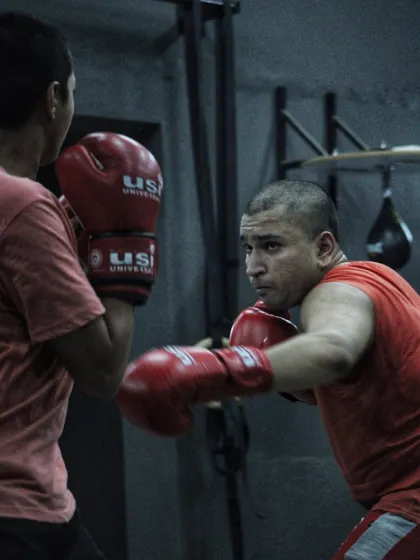 A fighter throwing a punch with focus and determination. Every movement in boxing has a purpose.
