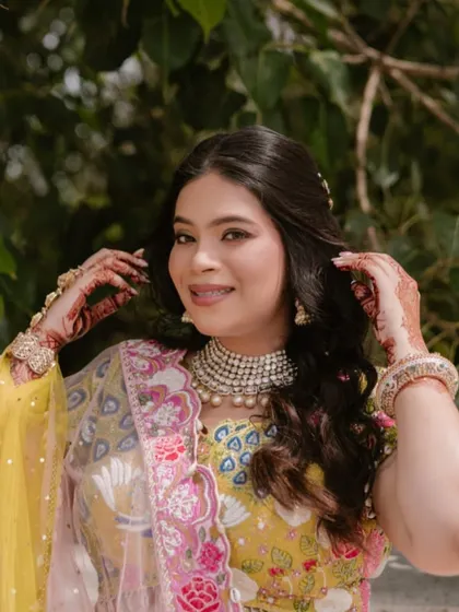 A close-up of the bride's happy face, showing her dewy skin and the subtle makeup that lets her personality shine.
