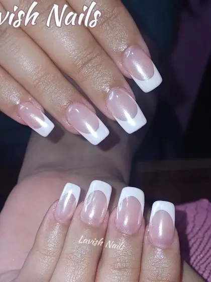 A classic French manicure on medium-length square nails, a chic and modern shape for this timeless design.
