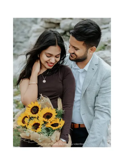 A sweet, tender moment captured in a vertical frame, perfect for sharing on social media, showing the groom admiring his bride as she holds a bouquet of sunflowers.
