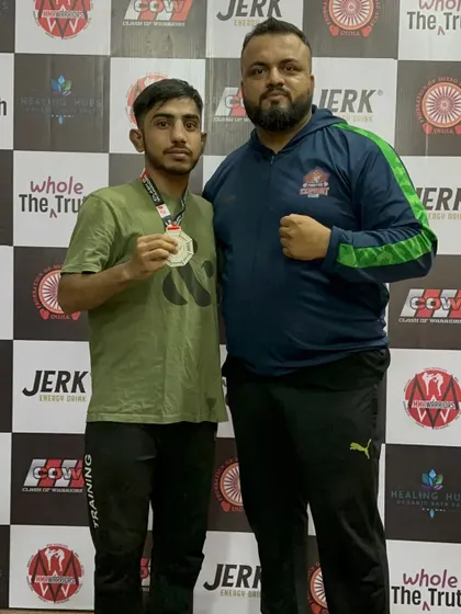 Me with one of our fighters after a hard-fought battle. Wins and losses are part of the game, but the team spirit and effort are always remarkable.