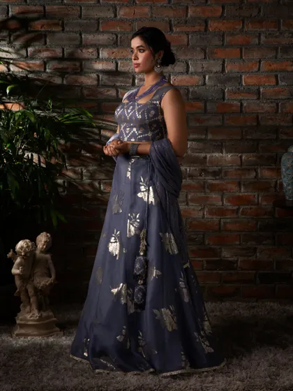 This lavender lehenga, with its blend of traditional motifs and contemporary color, is perfect for a bridesmaid or a guest at a summer wedding.