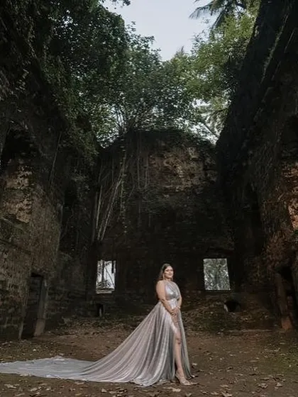 Another shot of our silver trail gown, showing how the long train drapes beautifully for a dramatic photo.
