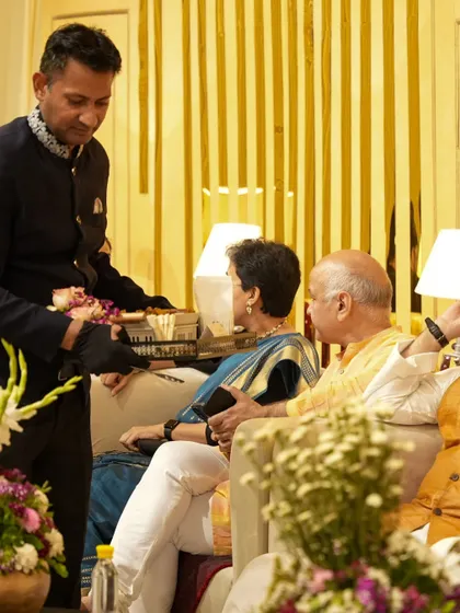 Our staff providing attentive, personalized service to senior guests at a high-profile event. We ensure every guest, regardless of their status, receives our utmost care and attention.