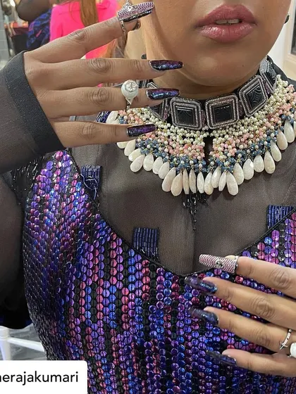 A close-up of the intricate, textured nail art I created for Raja Kumari's look.