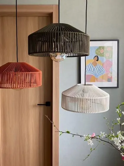 A collection of our drum-shaped pendant lights in three different colors. This image highlights how our designs can be customized with different finishes to suit a variety of decor styles, from neutral to bold.
