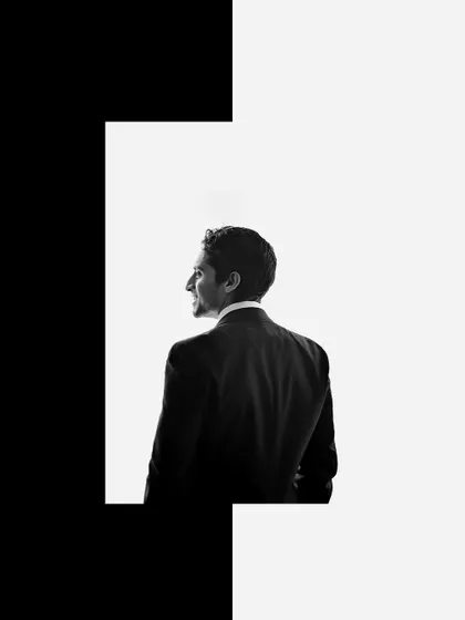 A creative and artistic black and white portrait of the groom.