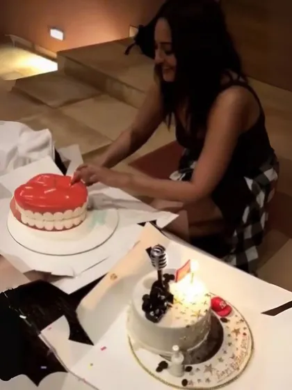 Sonakshi Sinha cutting into one of her birthday cakes. For this celebration, she had two of my custom themed cakes.